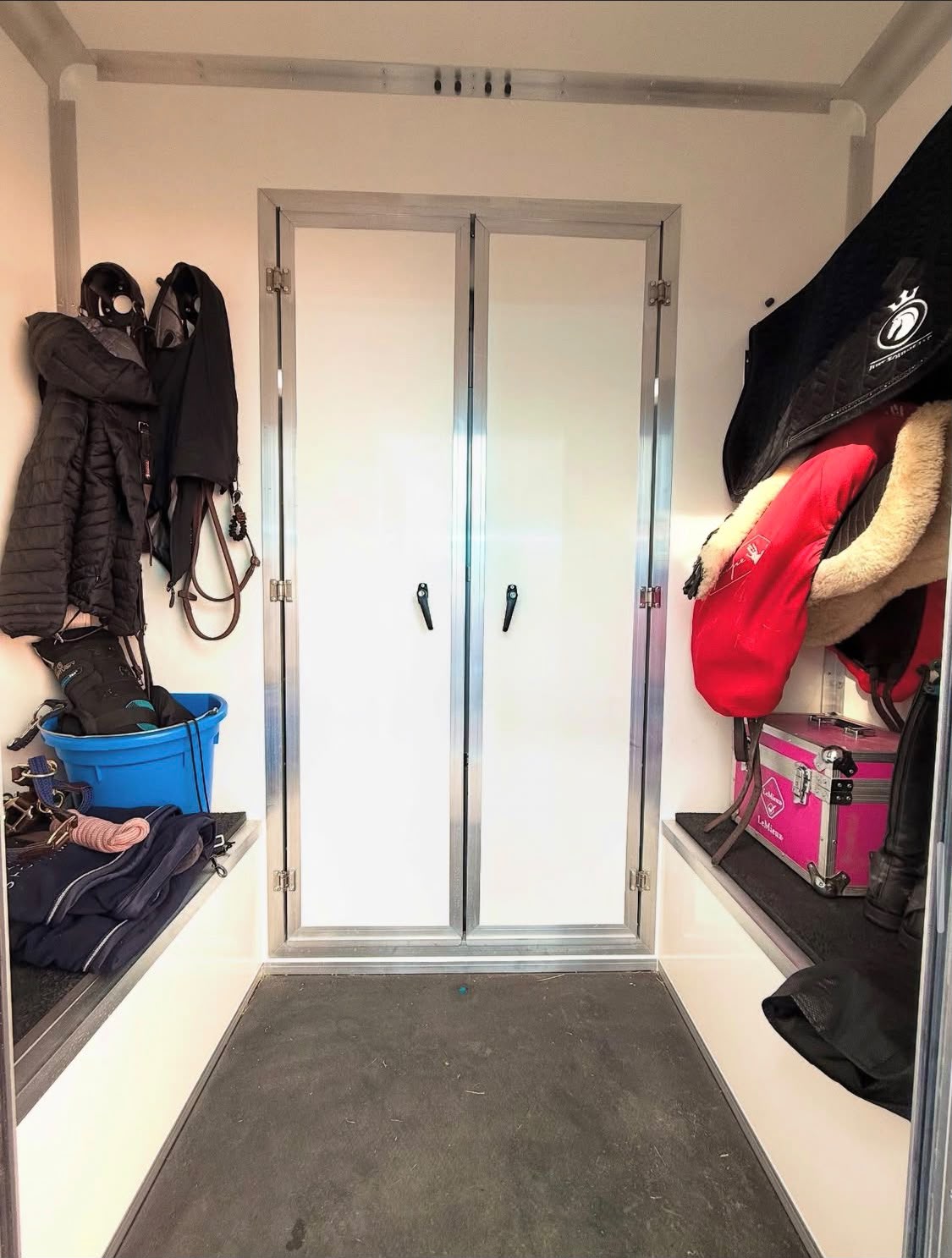 Groom's area inside the LS Horsebox Hire trailer with tack storage